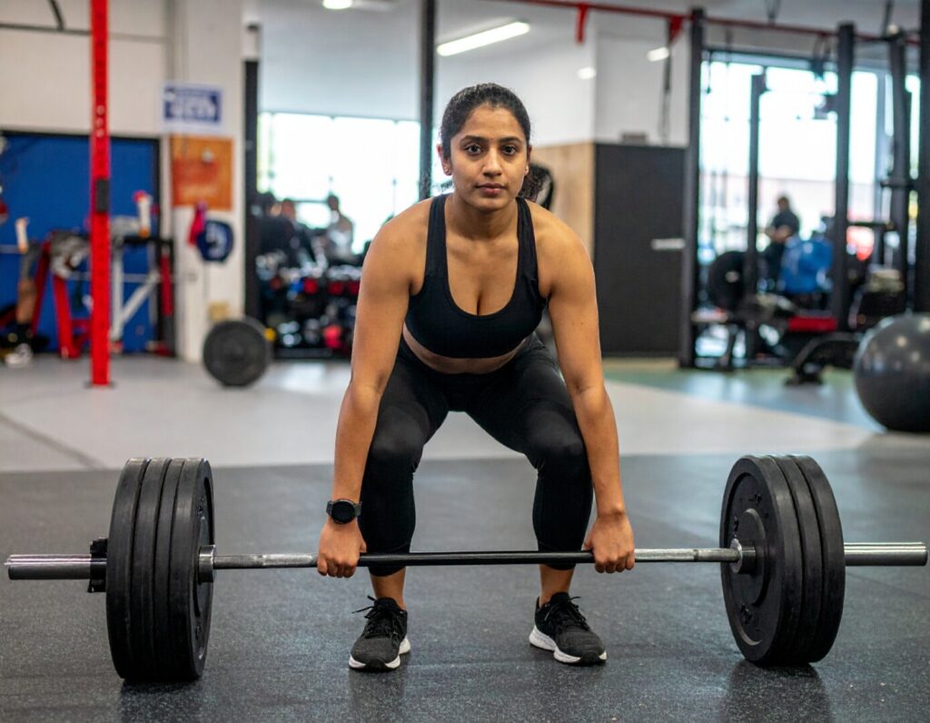 person in vancouver doing a deadlift in a gym